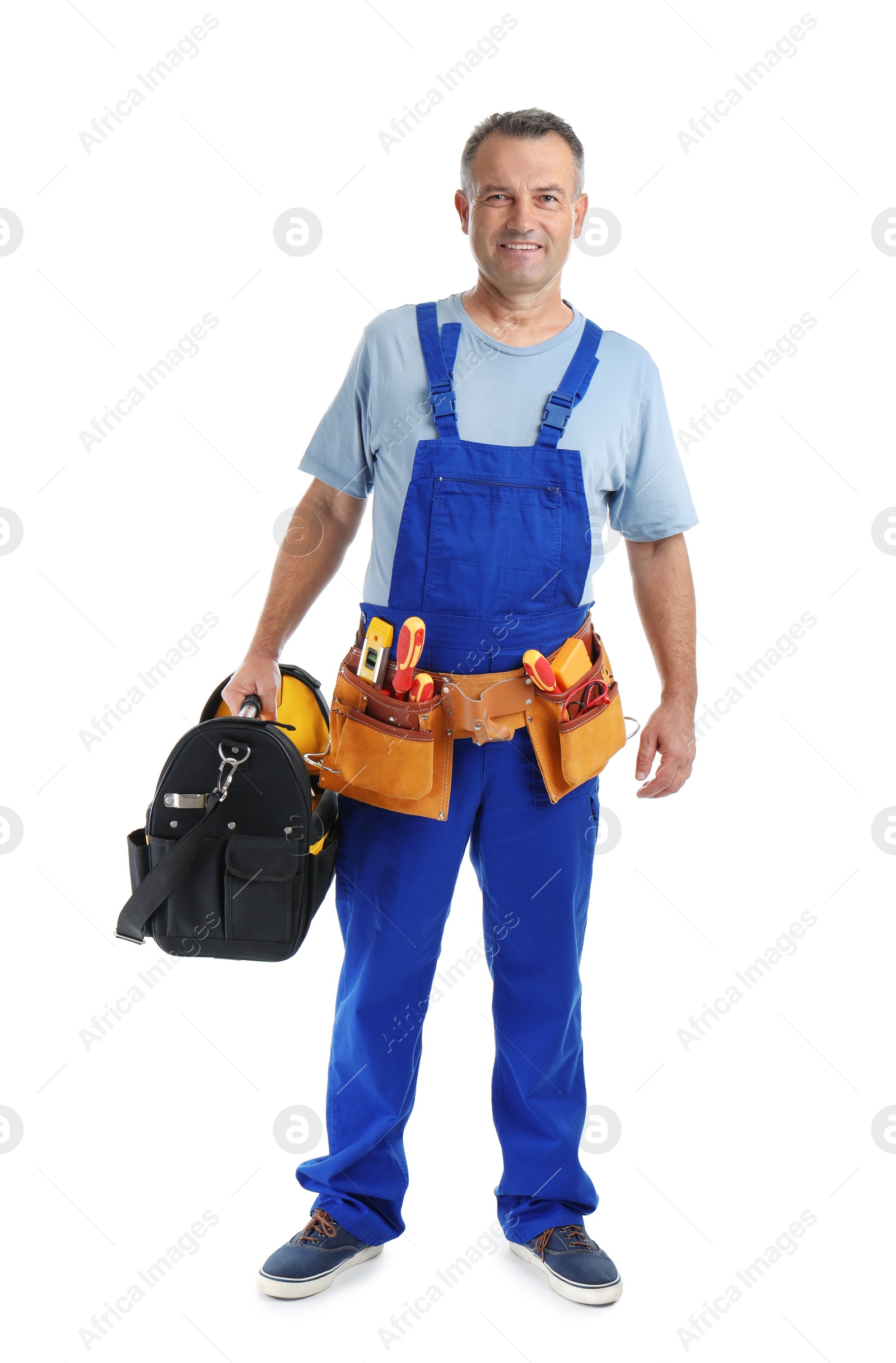 Photo of Electrician with tools wearing uniform on white background