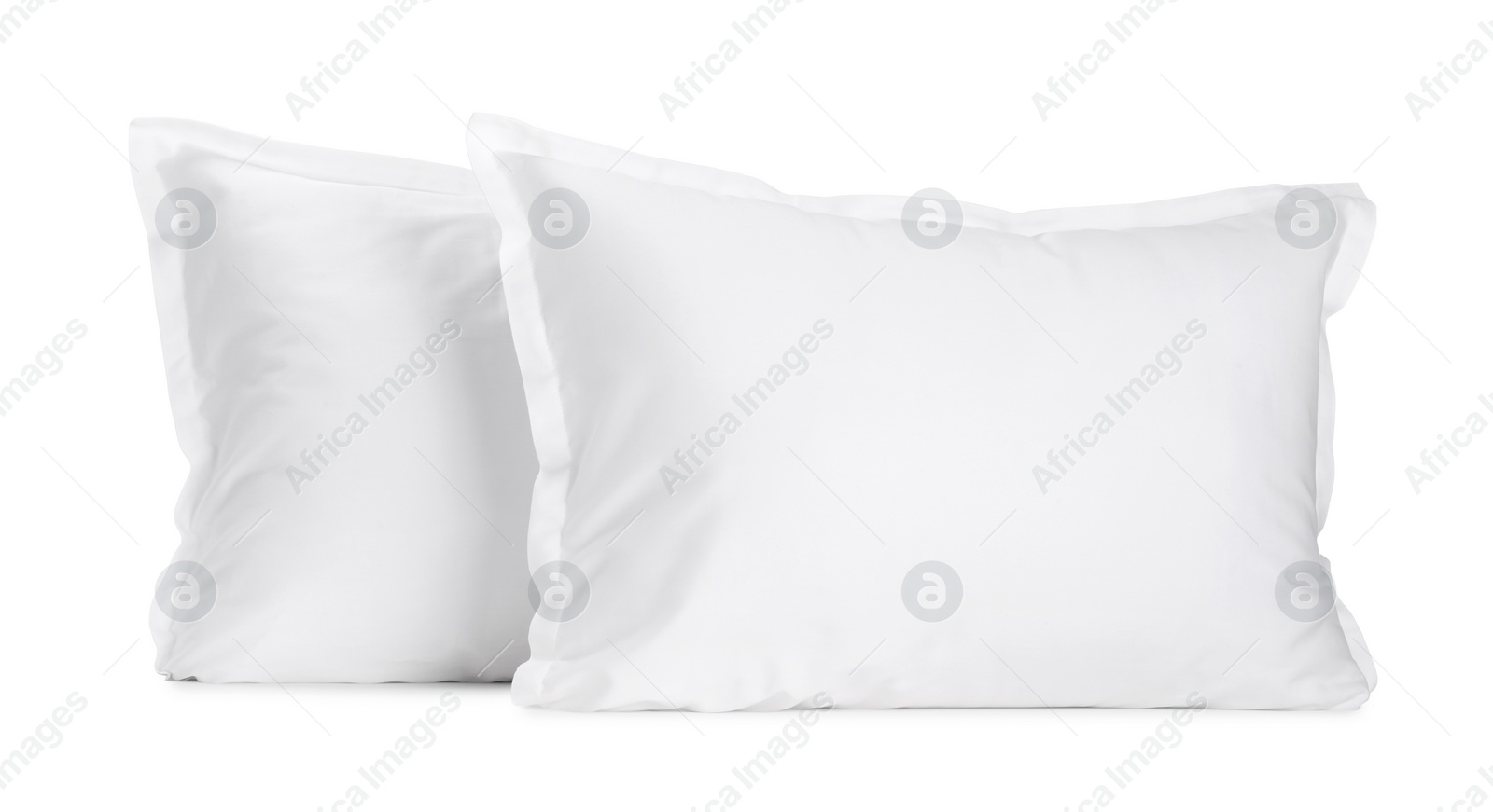 Photo of Two new soft pillows isolated on white