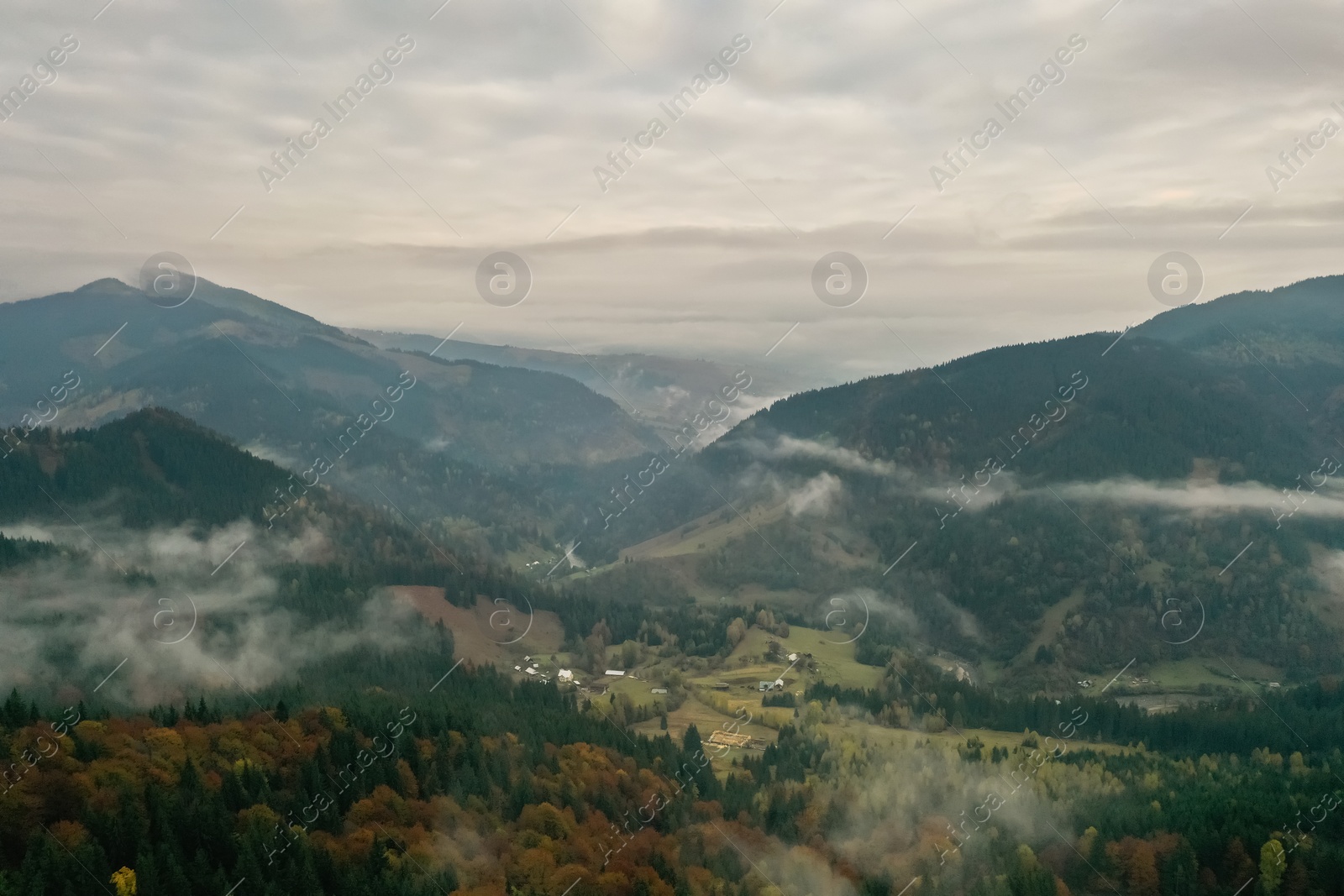 Photo of Aerial view of beautiful mountains on cloudy day