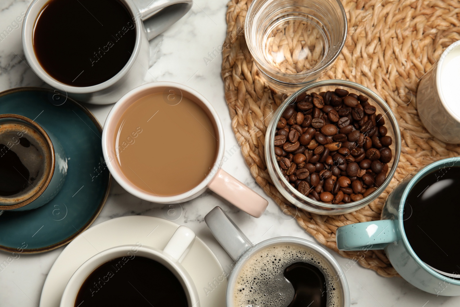 Photo of Flat lay composition with cups of coffee on marble background. Food photography