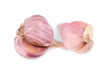 Photo of Heads of fresh garlic isolated on white, top view