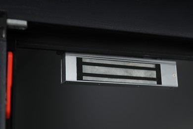 Photo of Electromagnetic door lock indoors, closeup. Home security