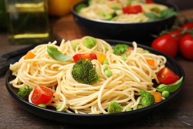 Photo of Plate of delicious pasta primavera, closeup view