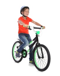 Portrait of cute little boy with bicycle on white background