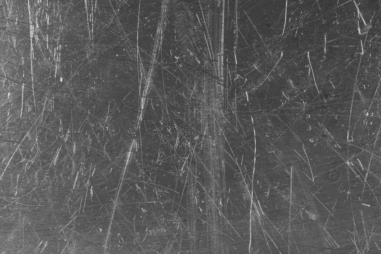 Photo of Texture of scratched metallic surface as background, closeup