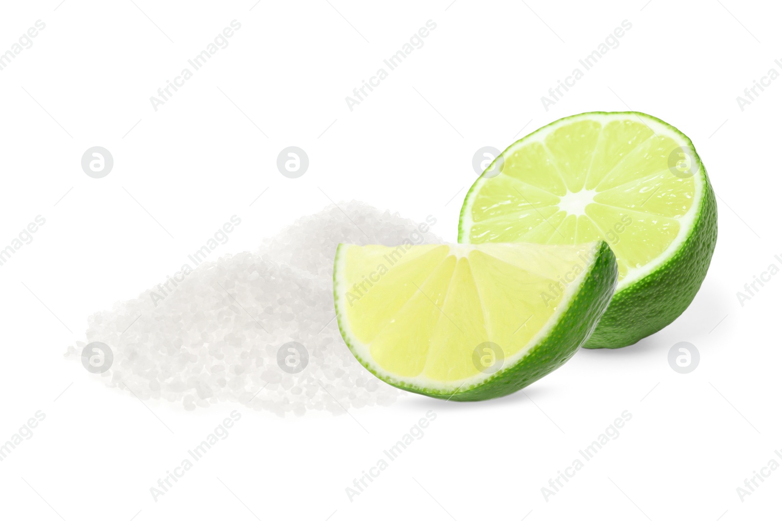 Image of Cut lime and salt isolated on white. Margarita cocktail ingredients