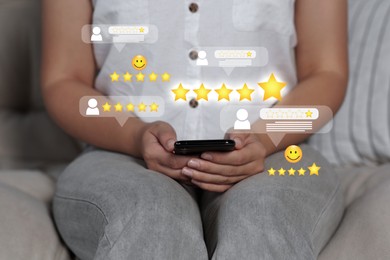 Woman leaving service feedback with smartphone at home, closeup. Reviews with emoticons and stars near device