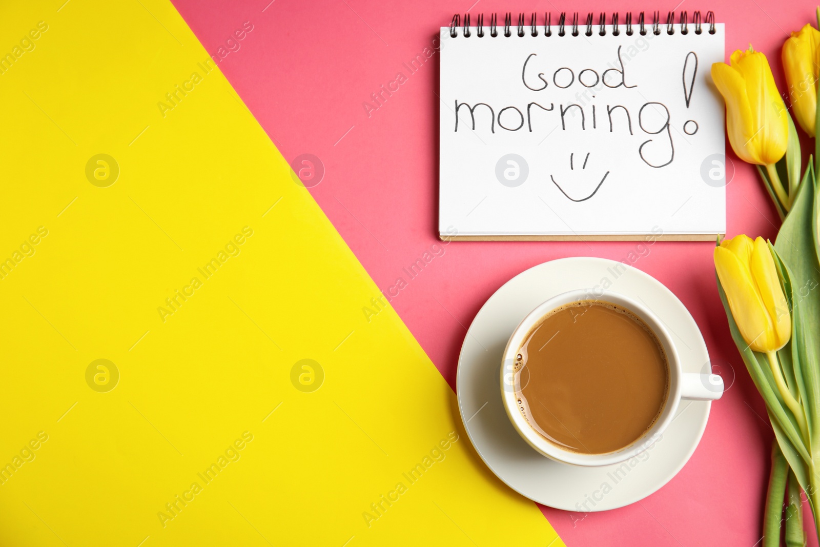 Photo of Delicious coffee, beautiful flowers and GOOD MORNING wish on color background, flat lay. Space for text