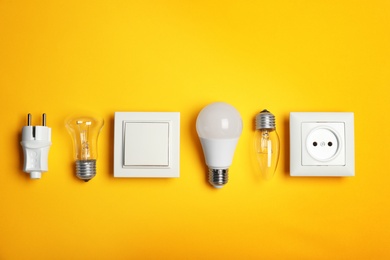 Flat lay composition with electrician's equipment on color background