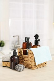 Different cleaning supplies in basket on table