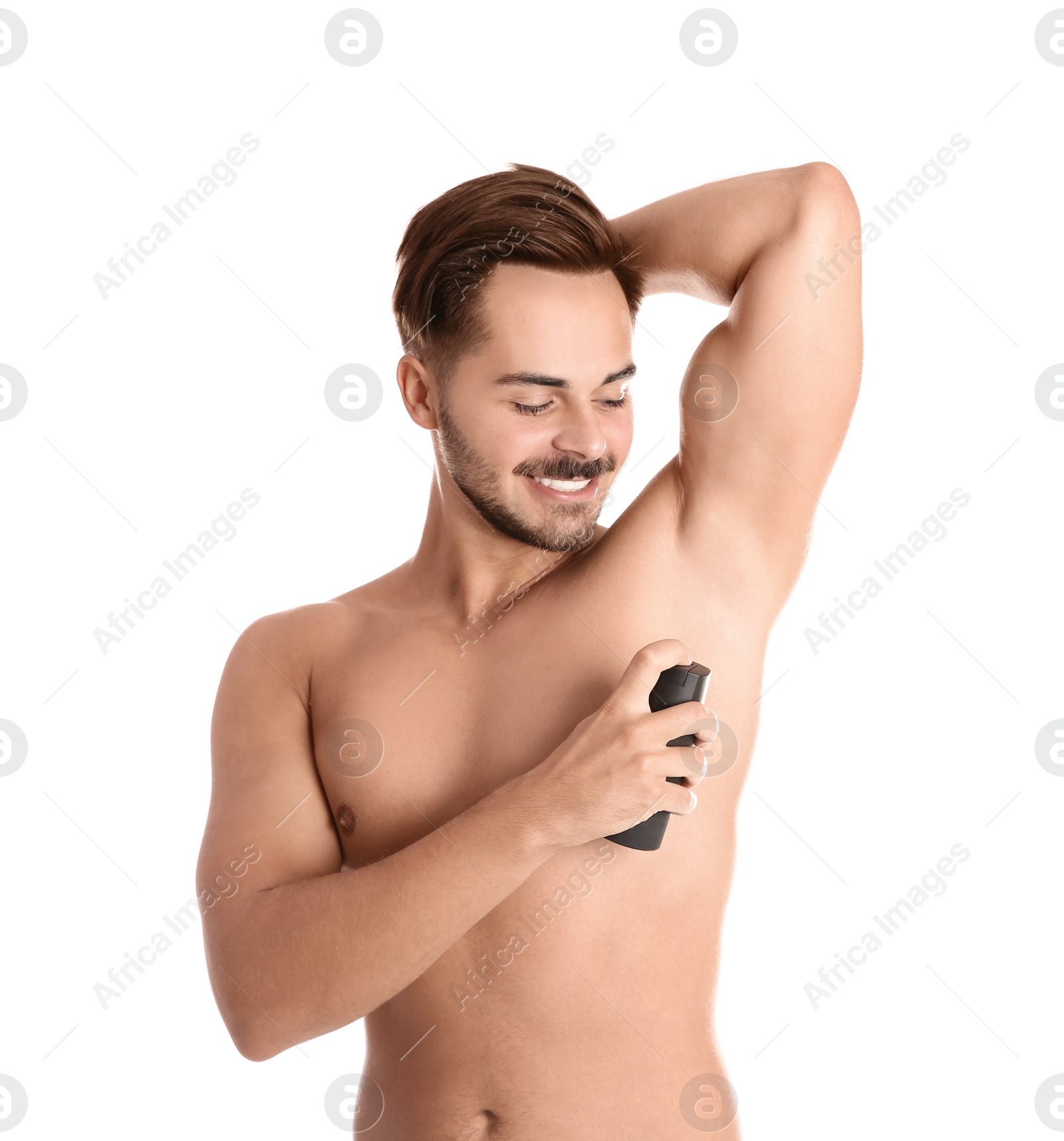 Photo of Young man using deodorant on white background