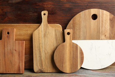 Photo of Set of different cutting boards on table