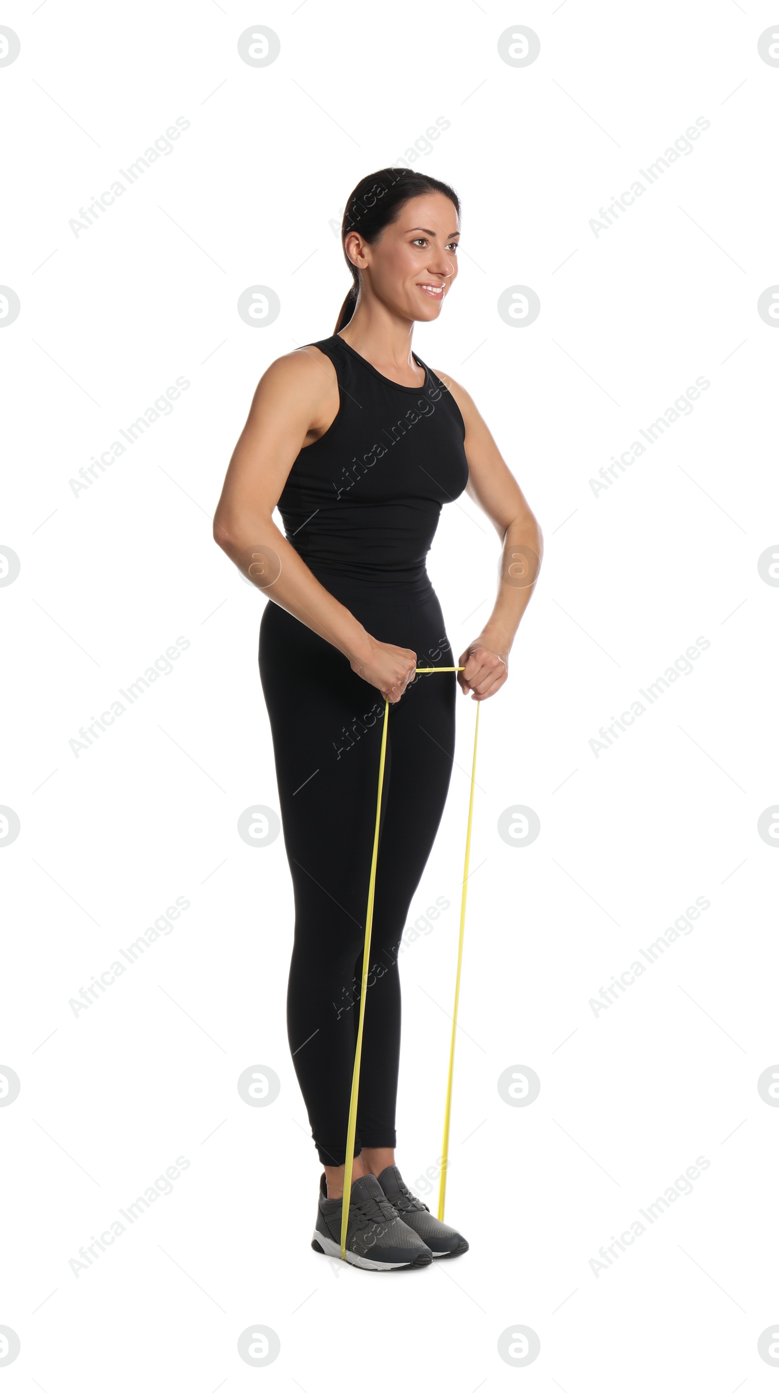 Photo of Woman doing sportive exercise with fitness elastic band on white background