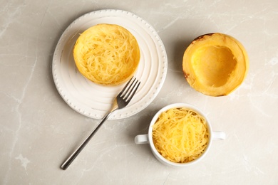 Cooked spaghetti squash served on table, flat lay