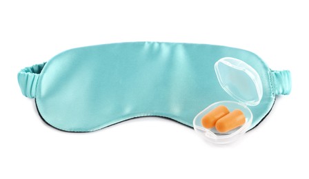Photo of Pair of ear plugs in case and light blue sleeping mask on white background
