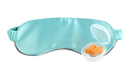 Pair of ear plugs in case and light blue sleeping mask on white background