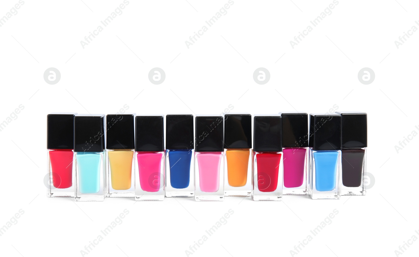 Photo of Bottles of nail polish on white background