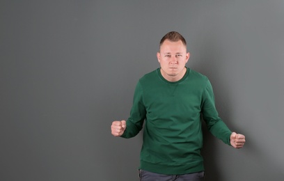 Portrait of handsome man on color background