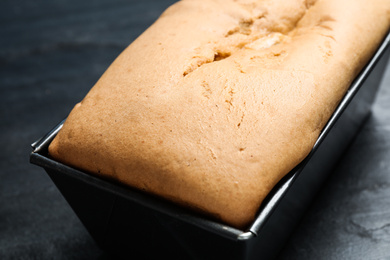 Tasty pear bread on black table, closeup. Homemade cake