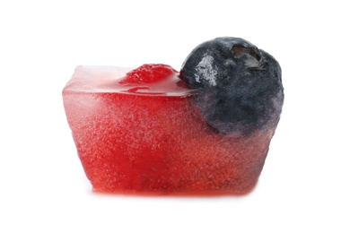 Photo of Ice cube with berries on white background