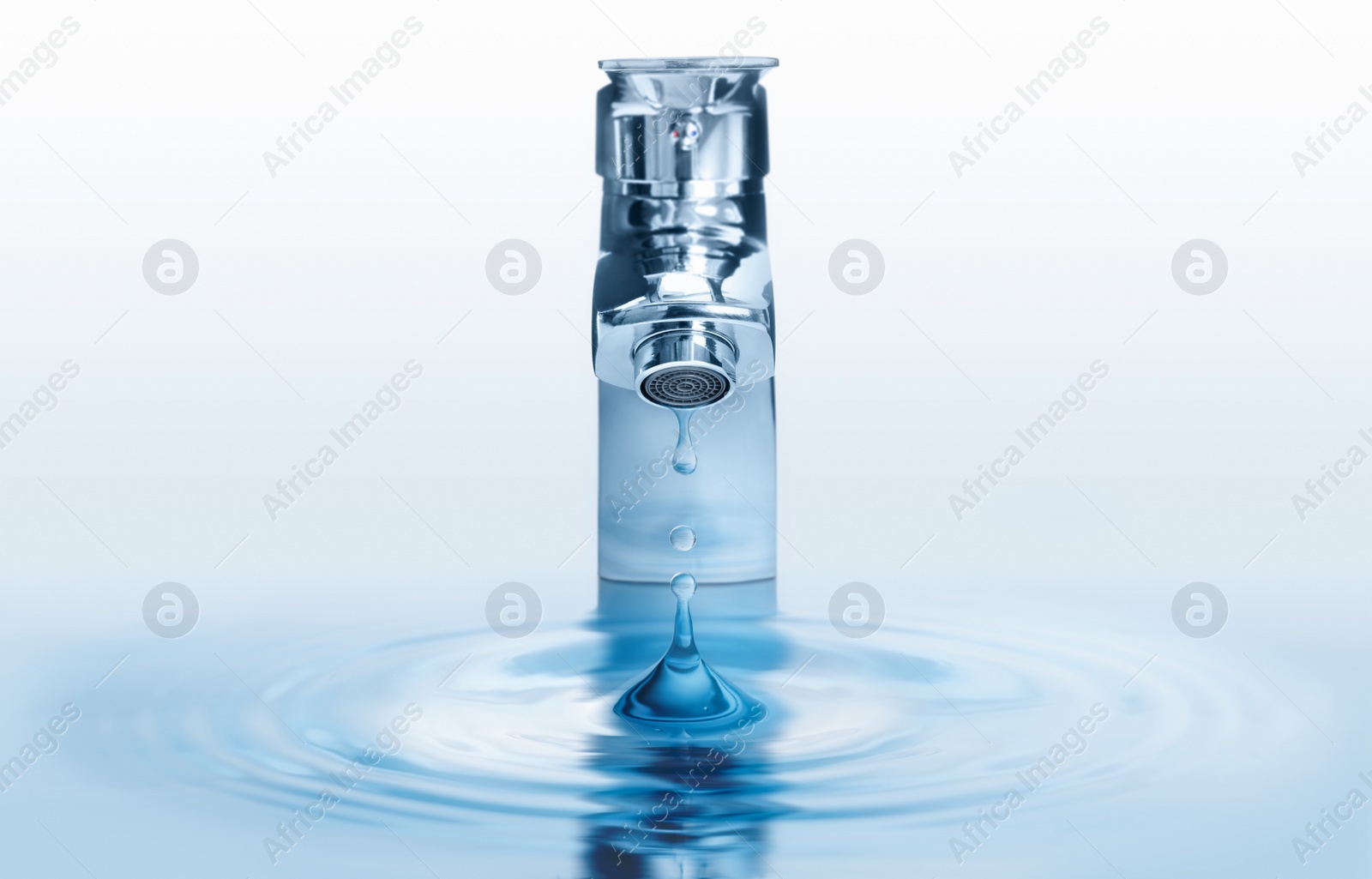 Image of Water dripping from tap with splash on light background