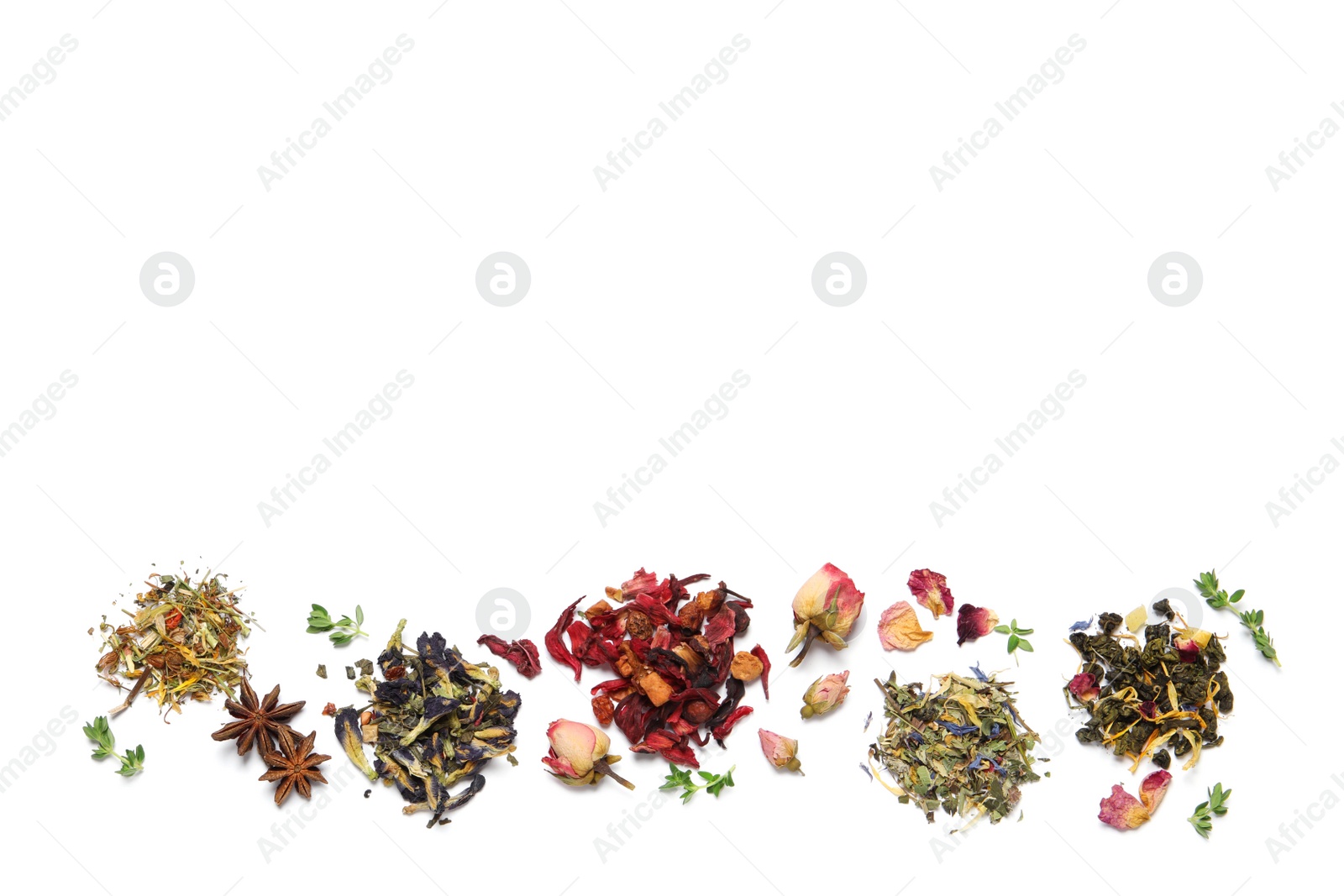 Photo of Different dry herbal teas on white background, top view