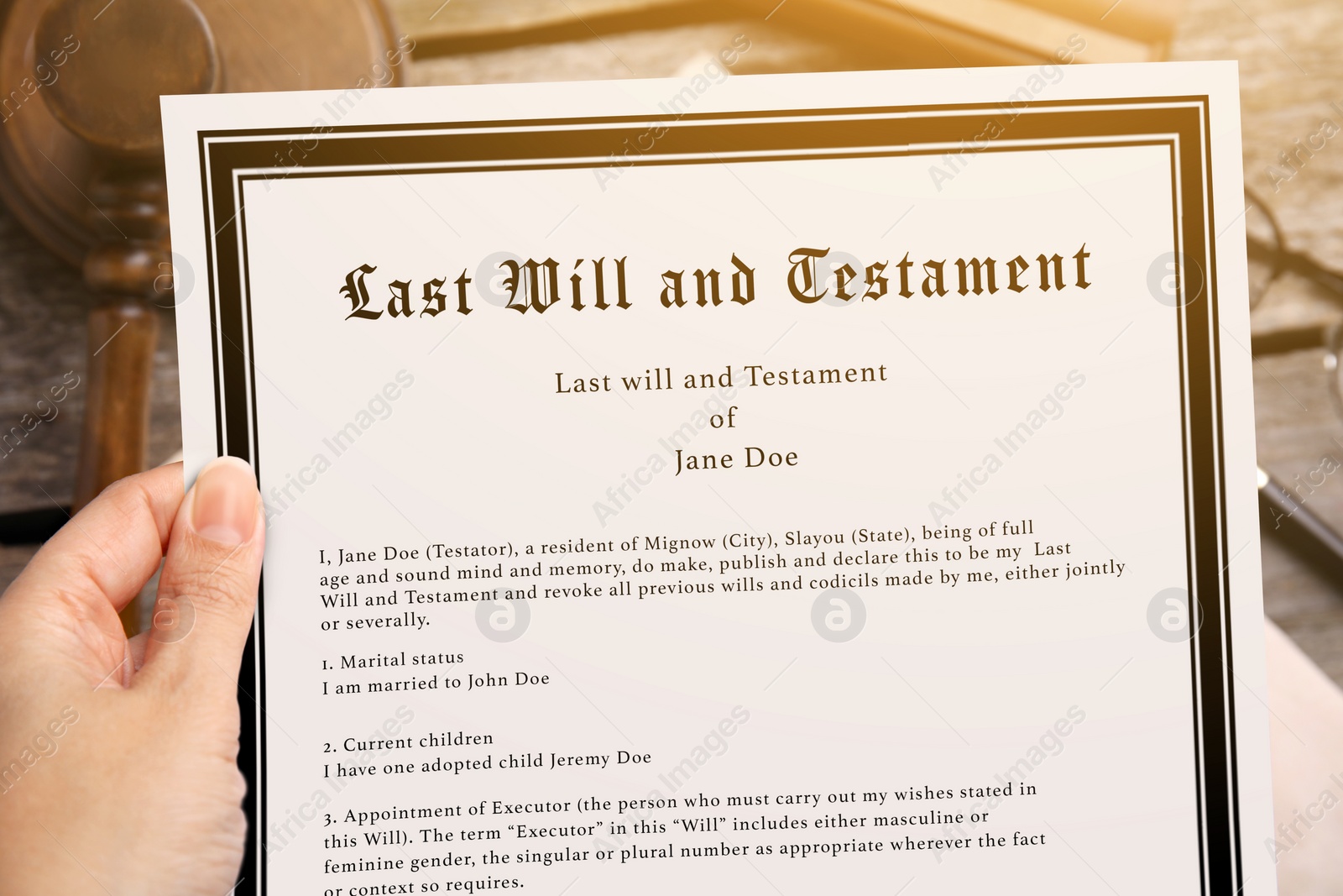 Image of Woman holding Last Will and Testament at table, closeup
