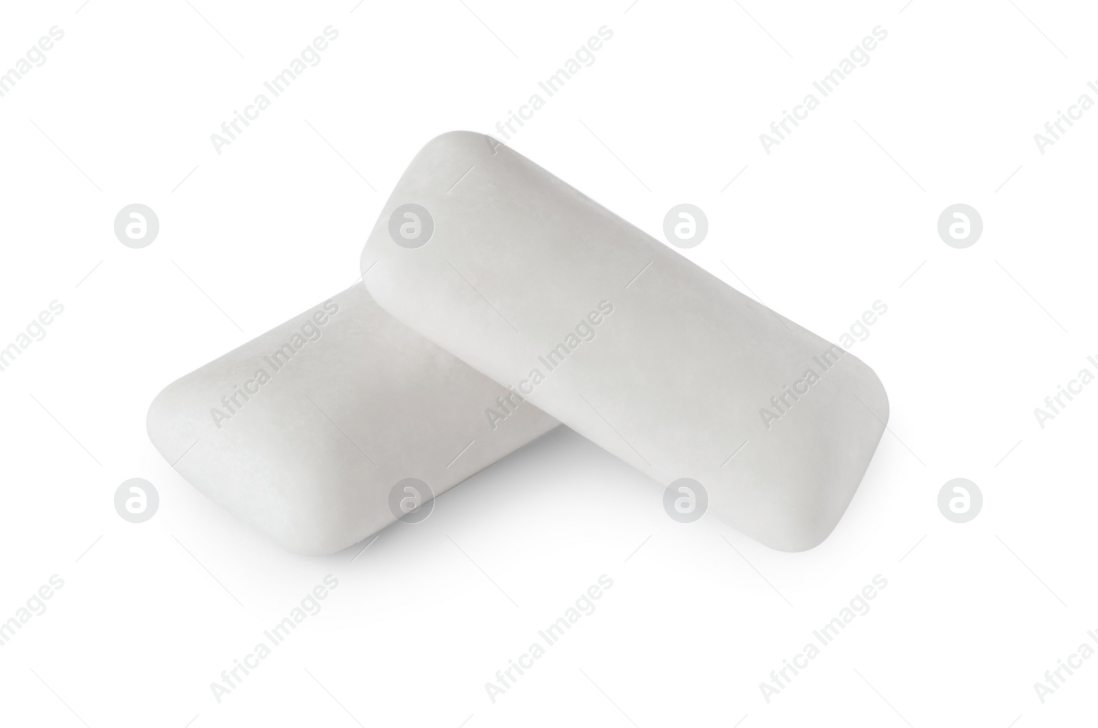 Photo of Two tasty chewing gums on white background