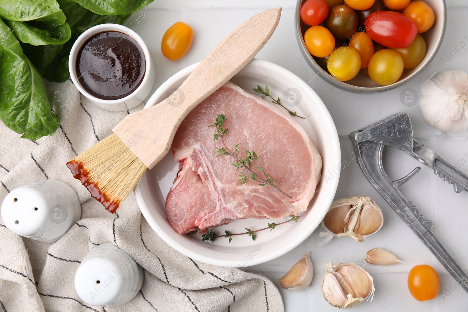 Photo of Flat lay composition with raw meat, thyme and marinade on white table