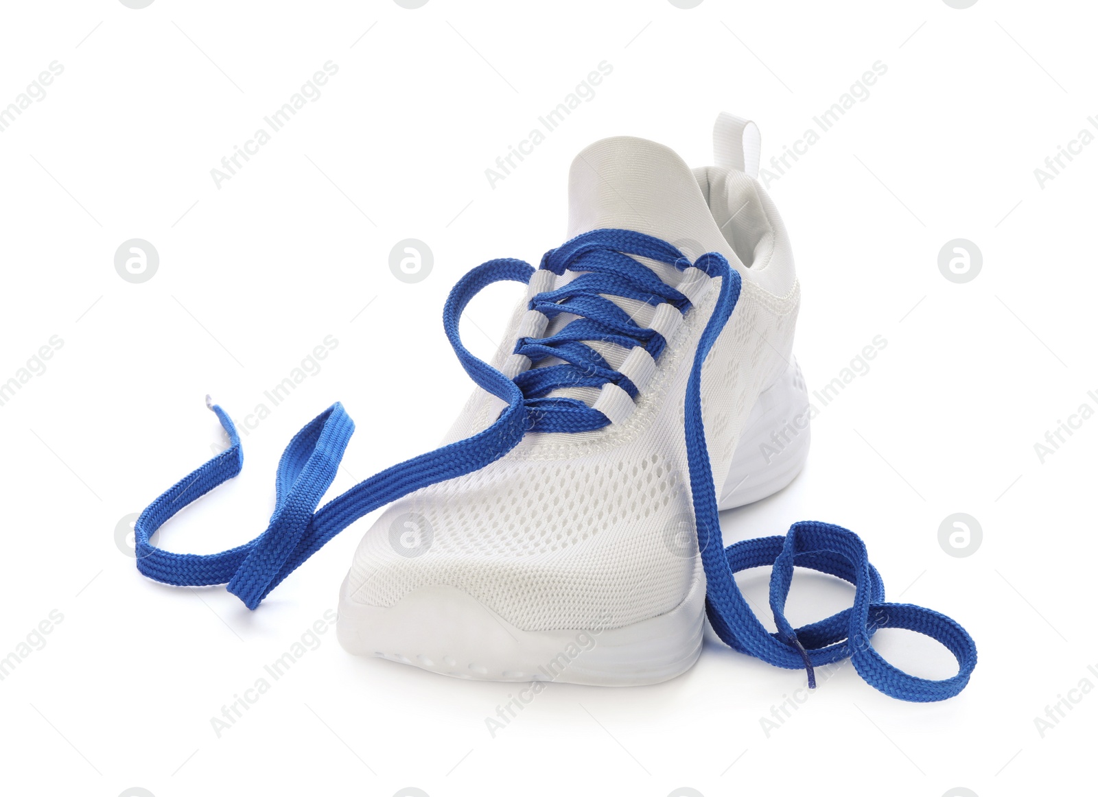 Photo of Stylish sneaker with blue shoelaces on white background