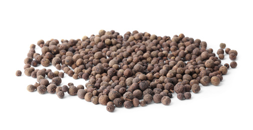 Heap of black pepper grains isolated on white