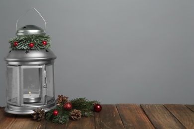 Lantern and Christmas decorations on grey background, space for text