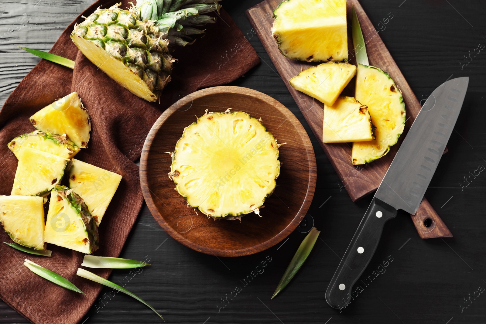 Photo of Composition with fresh sliced pineapple on table