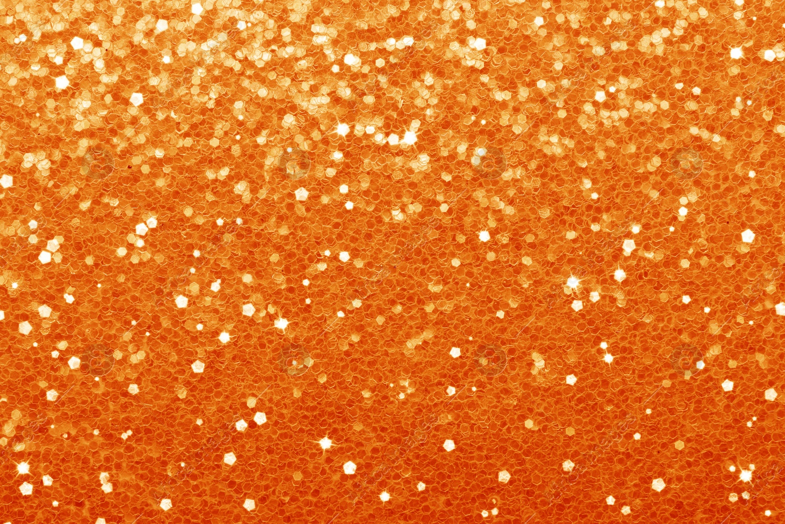 Image of Beautiful shiny orange glitter as background, closeup