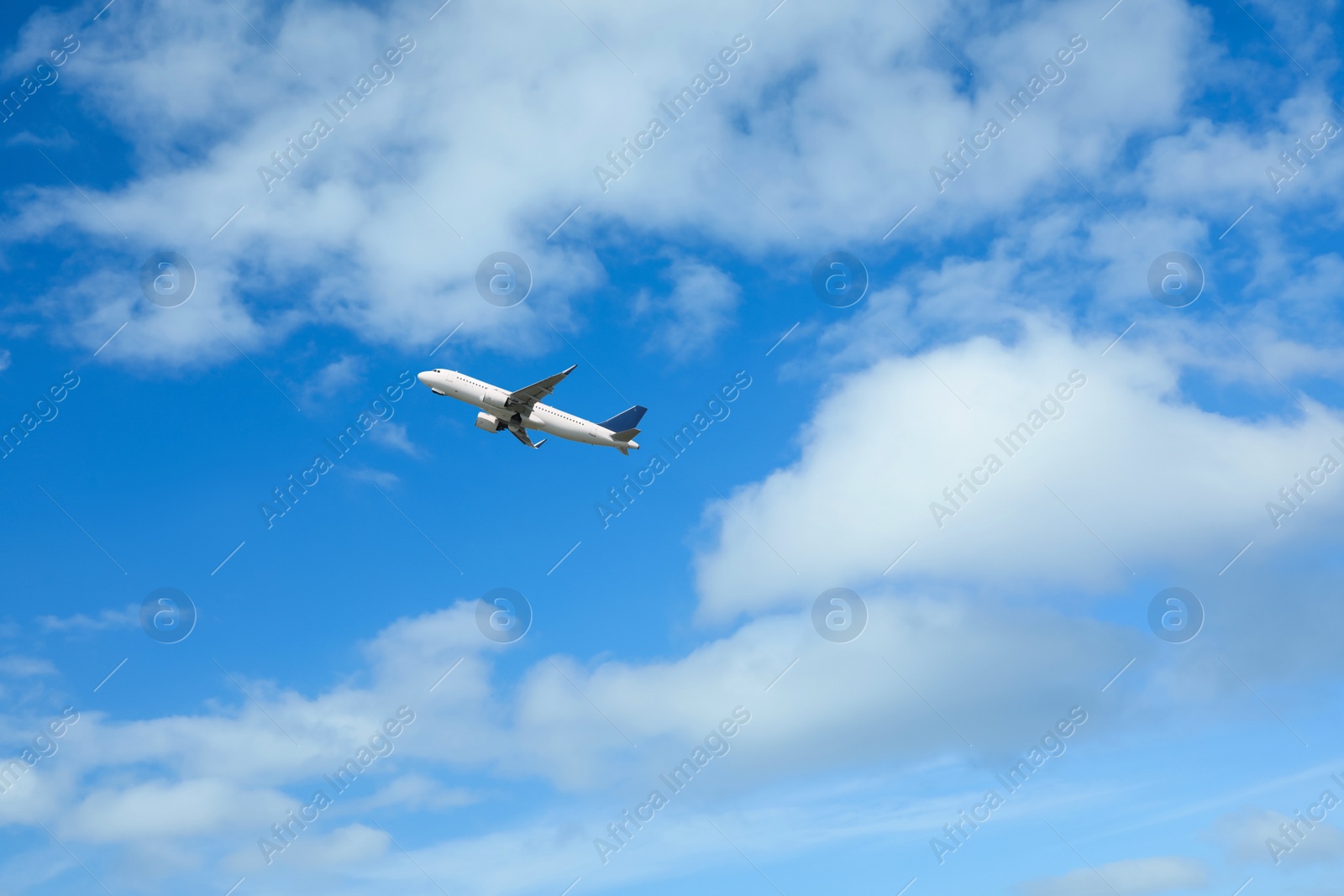 Photo of Beautiful view of modern airplane in blue sky. Space for text