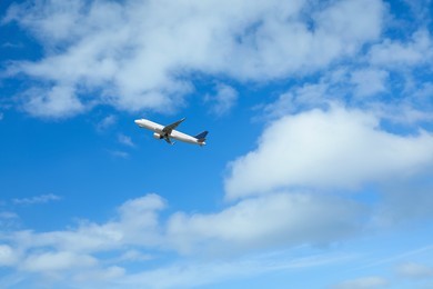 Photo of Beautiful view of modern airplane in blue sky. Space for text