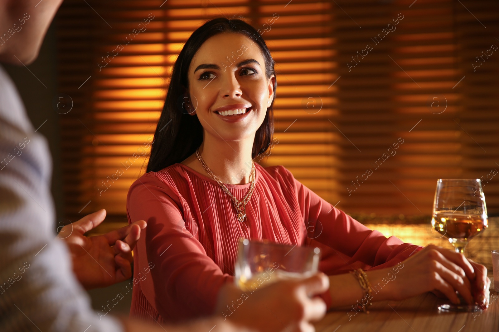 Photo of Man and woman flirting with each other in bar