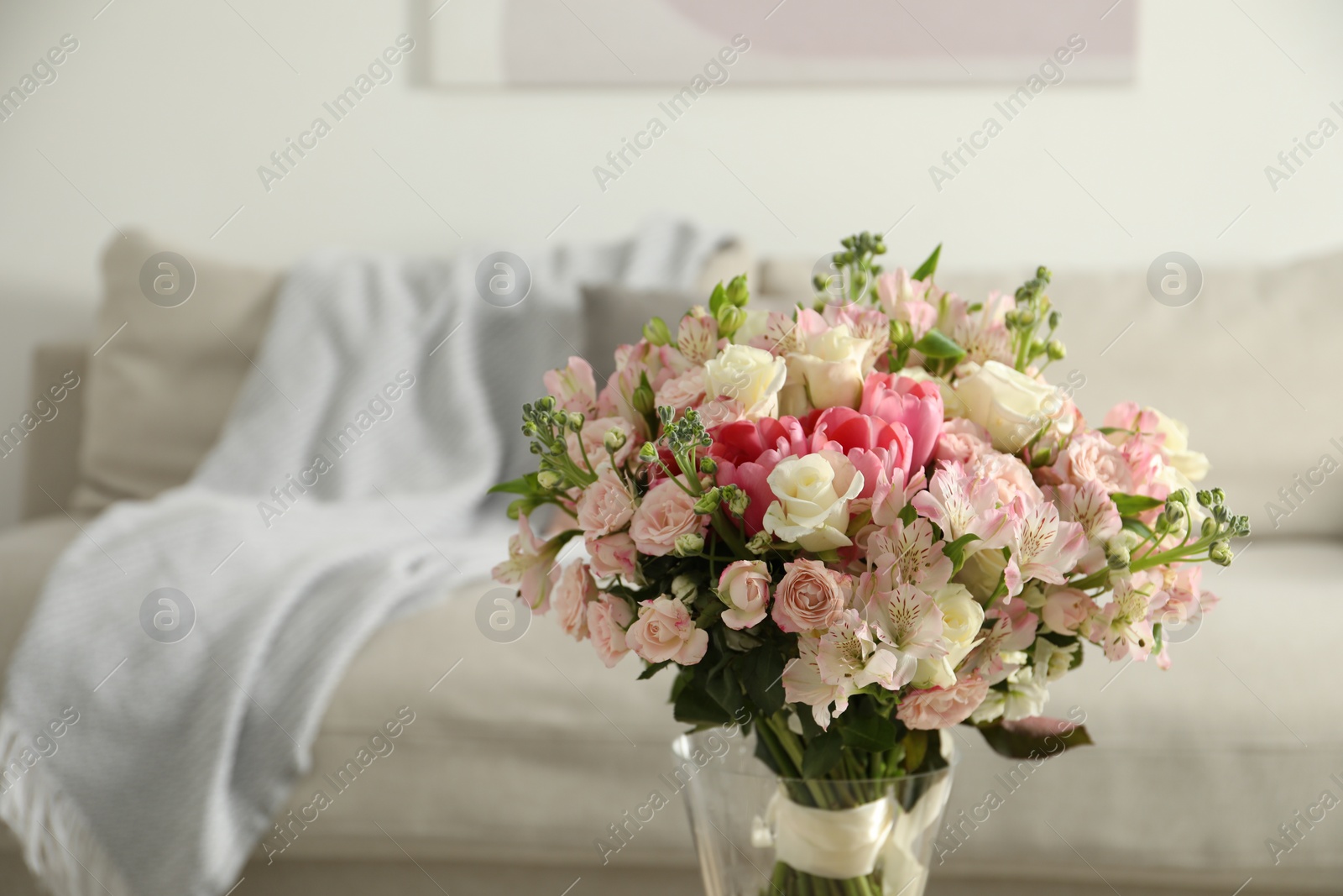 Photo of Beautiful bouquet of fresh flowers in vase indoors, space for text