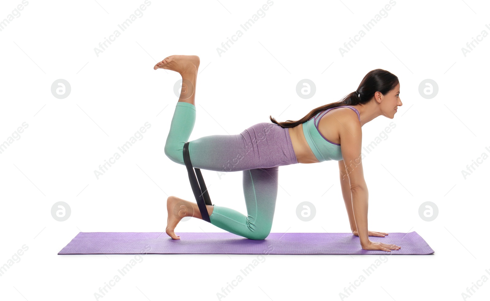 Photo of Woman doing sportive exercise with fitness elastic band on white background