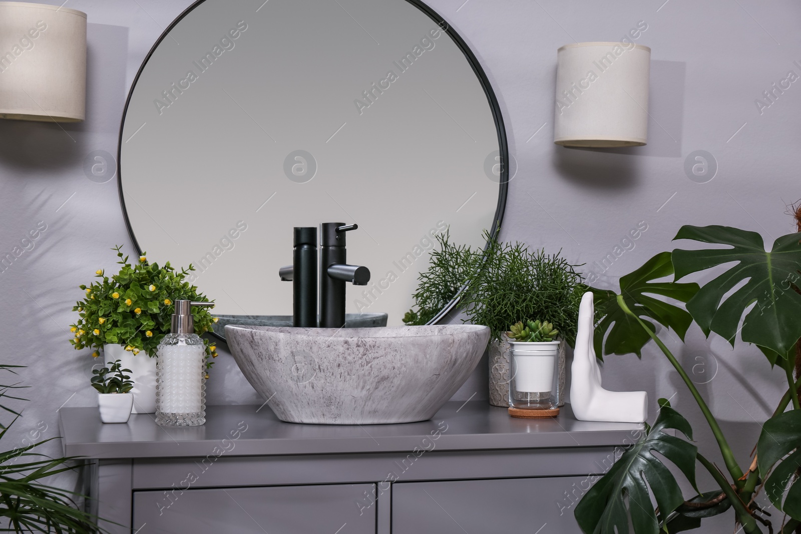 Photo of Stylish sink and beautiful green houseplants in bathroom. Interior design