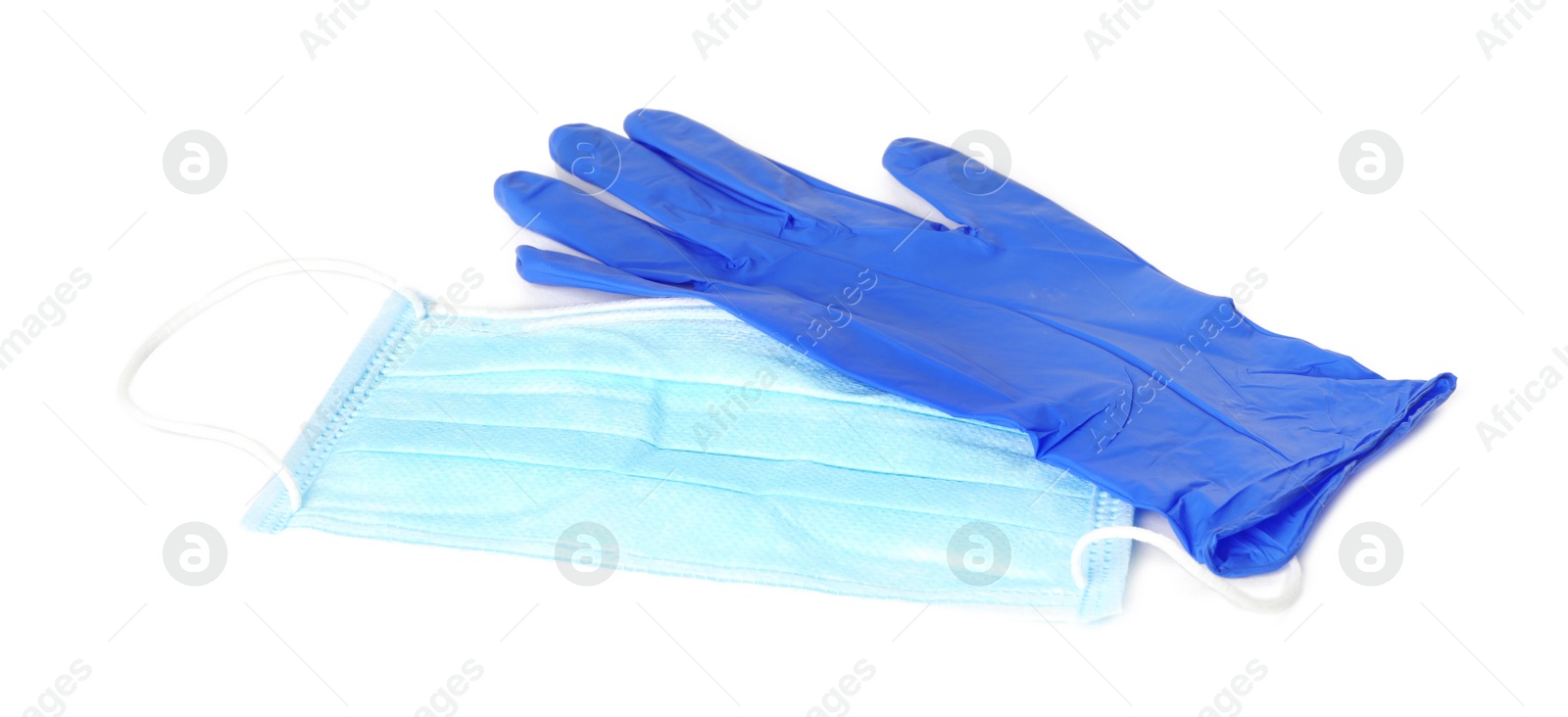Photo of Medical glove and protective face mask on white background