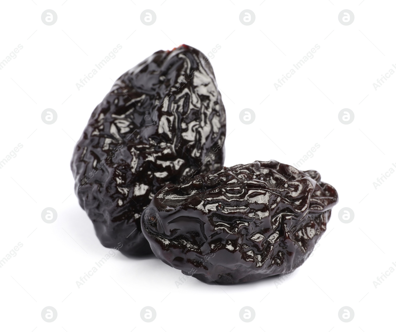 Photo of Sweet dried prunes on white background. Healthy snack