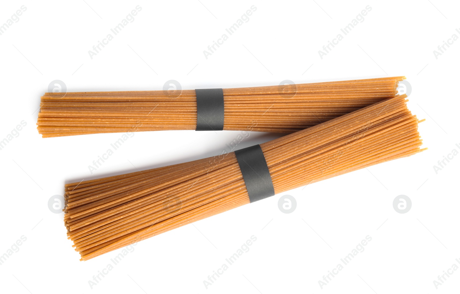 Photo of Uncooked buckwheat noodles isolated on white, top view