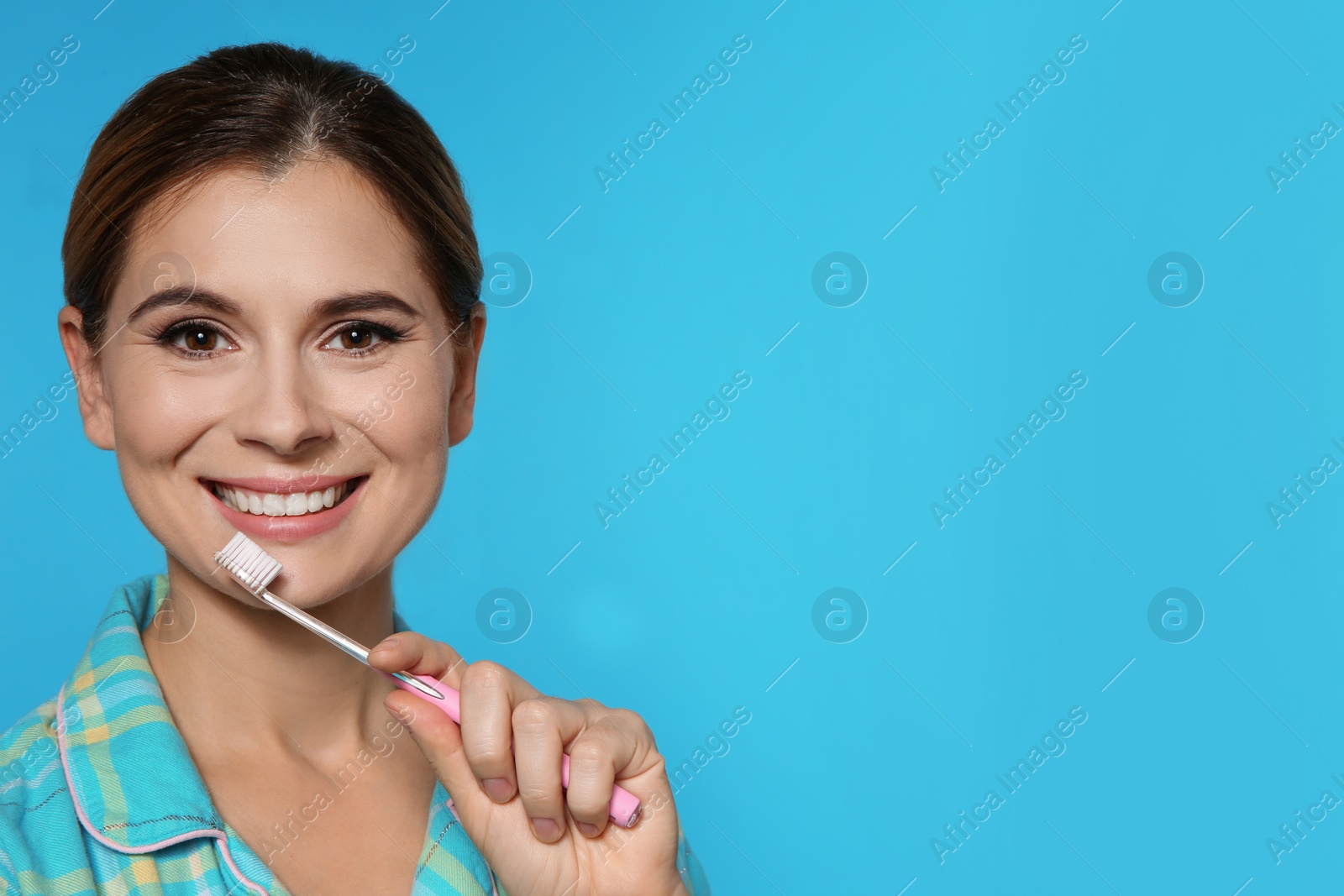 Photo of Portrait of woman with toothbrush on color background. Space for text