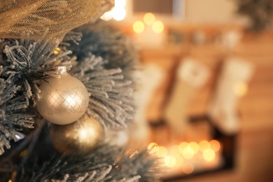 Photo of Beautiful decorated Christmas tree in festive room interior, closeup