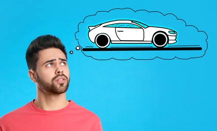 Car buying. Man dreaming about auto on light blue background
