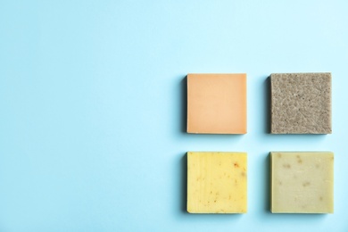 Photo of Hand made soap bars on color background, top view. Space for text