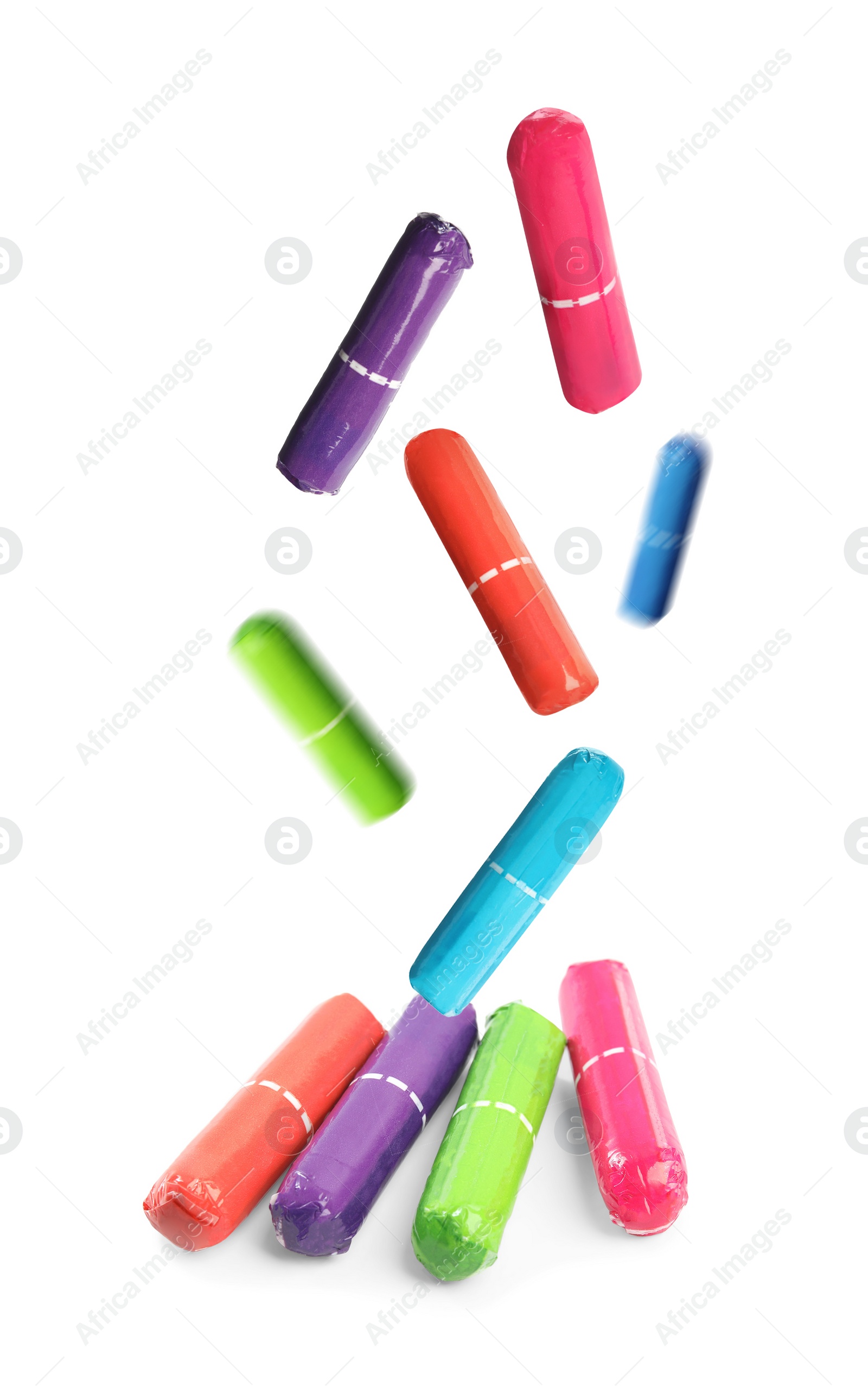 Image of Many tampons falling on white background. Menstrual hygienic product