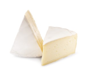 Photo of Pieces of tasty camembert cheese isolated on white