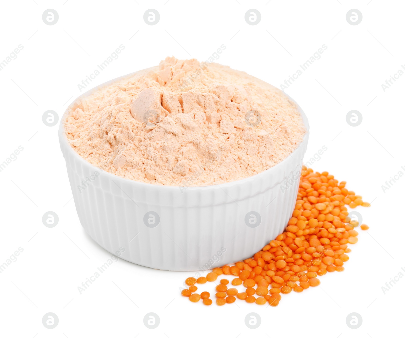 Photo of Bowl with lentil flour and grains on white background